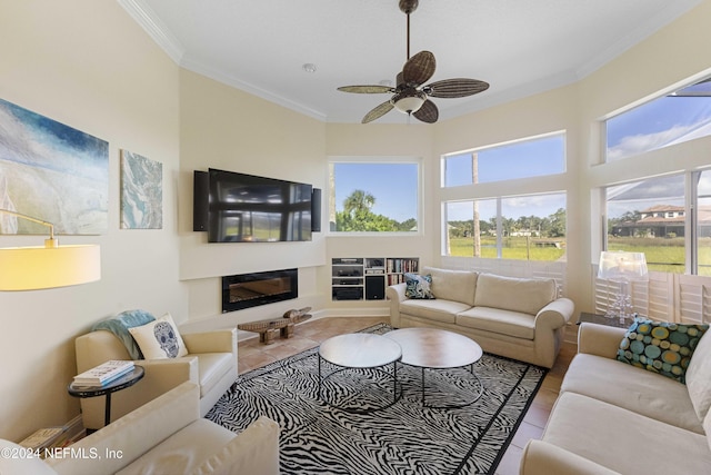 living area featuring crown molding, tile patterned floors, and plenty of natural light