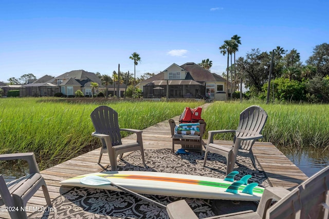 dock area with a water view