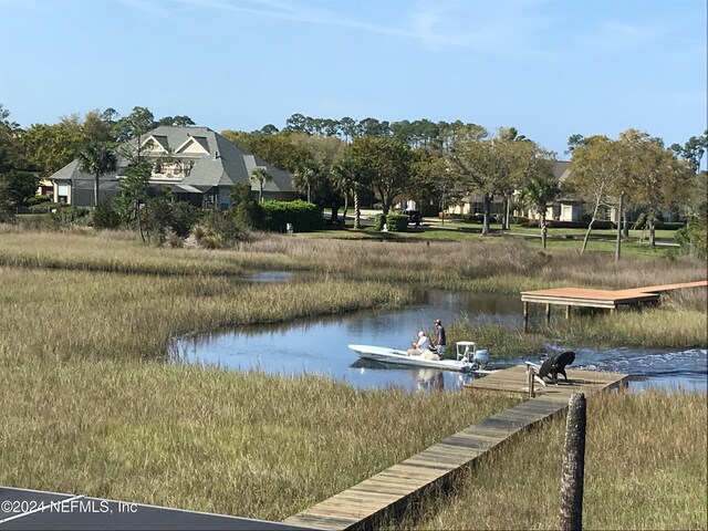 dock area featuring a water view