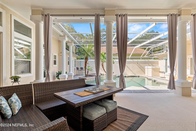 sunroom / solarium featuring a healthy amount of sunlight