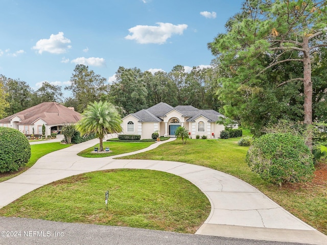 single story home featuring a front yard