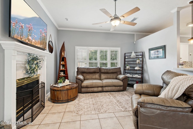 living room with ceiling fan, light tile patterned floors, and ornamental molding