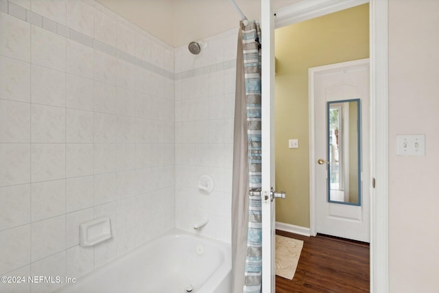 bathroom featuring ornamental molding, shower / bath combo, and hardwood / wood-style flooring