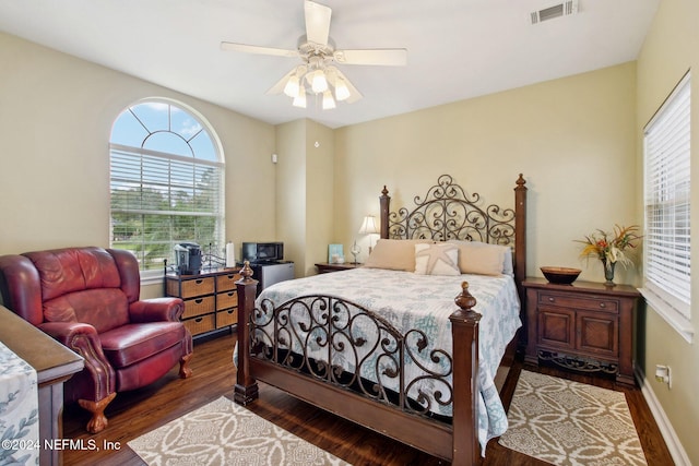 bedroom featuring ceiling fan and dark hardwood / wood-style flooring