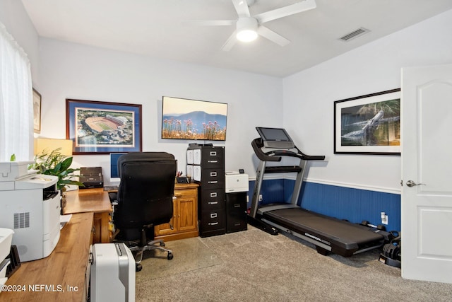 home office with ceiling fan and light carpet