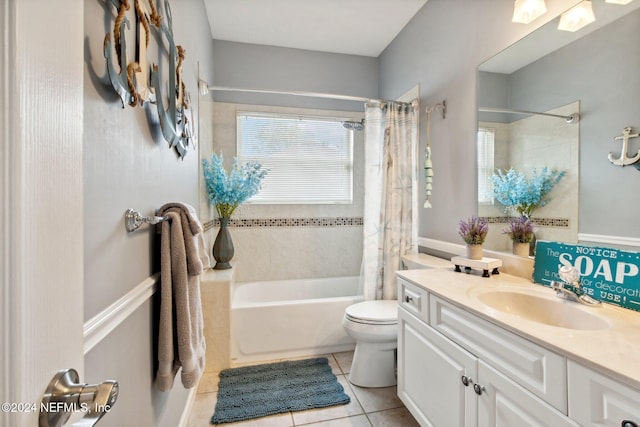 full bathroom with tile patterned floors, vanity, shower / tub combo, and toilet