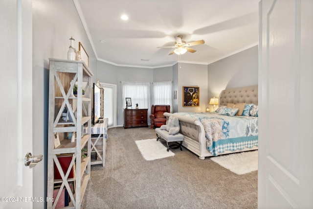 bedroom featuring ceiling fan, carpet, and ornamental molding