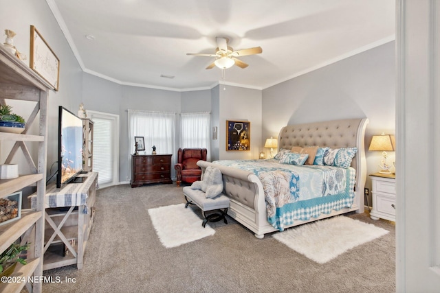 carpeted bedroom featuring ceiling fan and ornamental molding