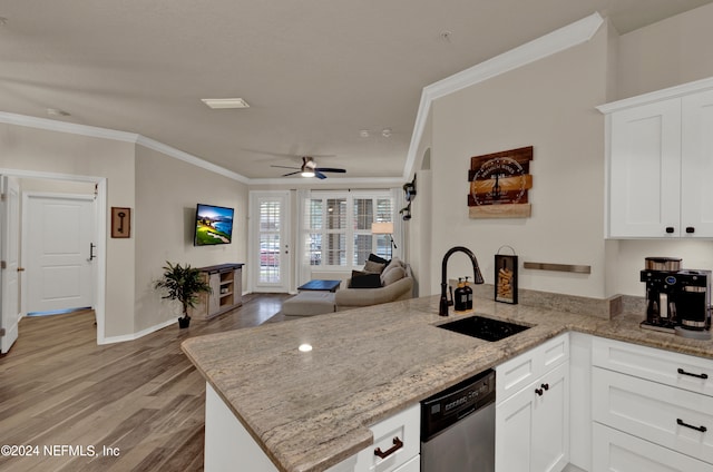 kitchen with dishwasher, kitchen peninsula, sink, white cabinets, and light hardwood / wood-style floors