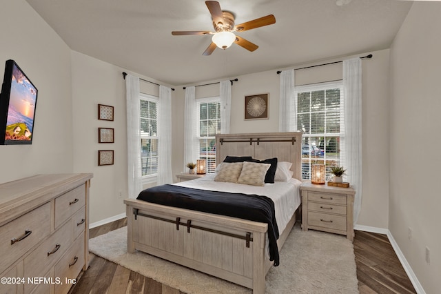 bedroom featuring ceiling fan and dark hardwood / wood-style flooring