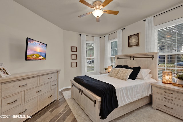 bedroom featuring light wood-type flooring and ceiling fan