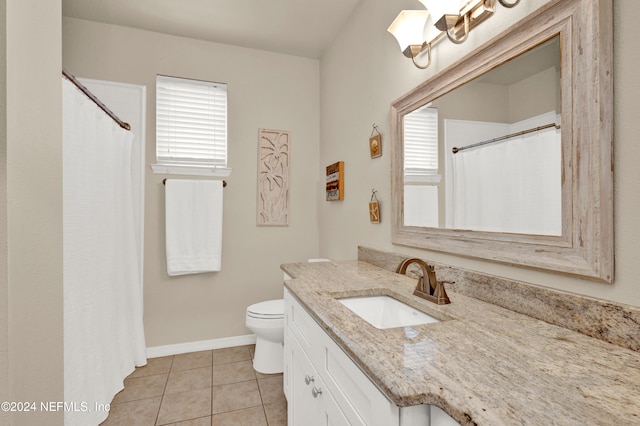 bathroom featuring toilet, vanity, a shower with shower curtain, and tile patterned flooring