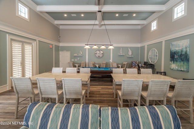 dining area featuring a healthy amount of sunlight and a high ceiling