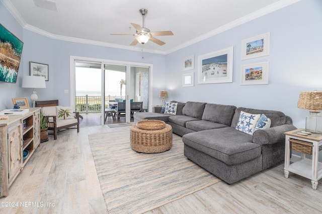 living room with crown molding, ceiling fan, light wood finished floors, and visible vents