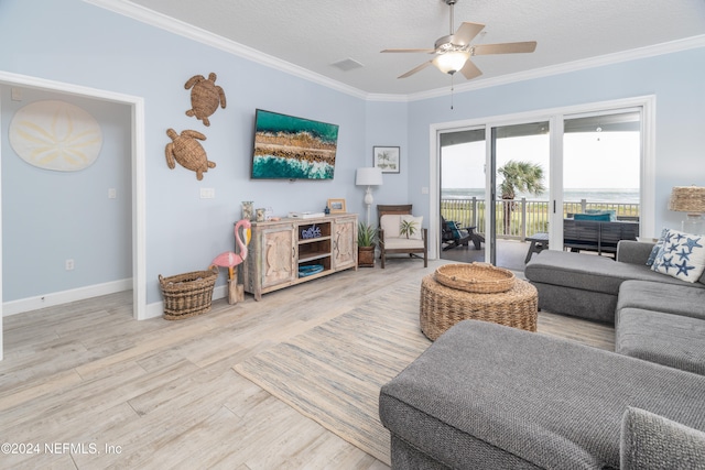 living room with crown molding, hardwood / wood-style floors, a textured ceiling, and ceiling fan