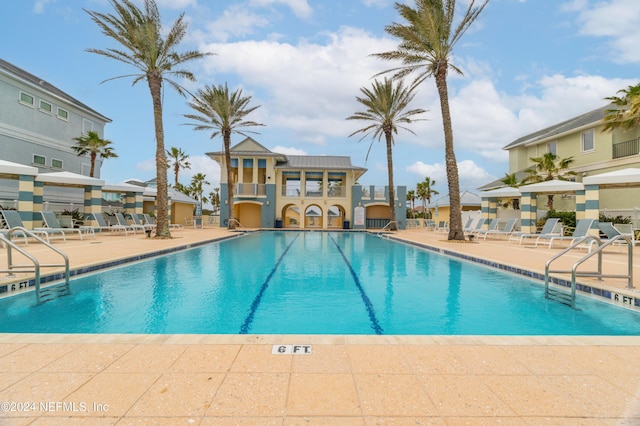 pool with a patio area