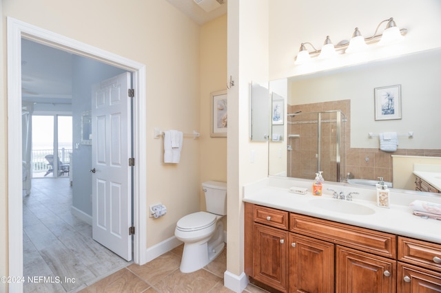 bathroom with vanity, toilet, an enclosed shower, and hardwood / wood-style floors