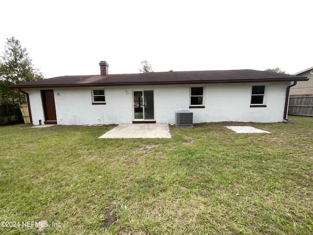 back of property featuring a patio area, a yard, and central AC unit