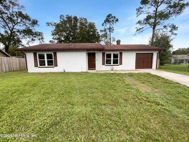 ranch-style house with a front lawn and a garage