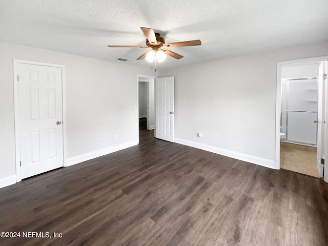 unfurnished room featuring dark hardwood / wood-style floors, a textured ceiling, and ceiling fan