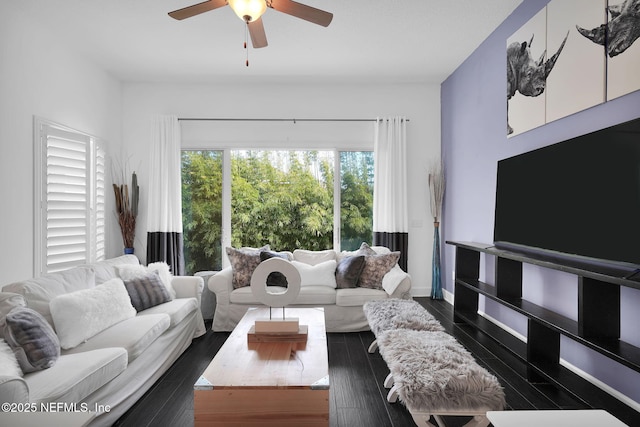 living room with ceiling fan and dark hardwood / wood-style floors