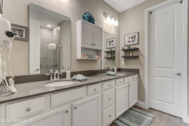 bathroom featuring vanity and an enclosed shower