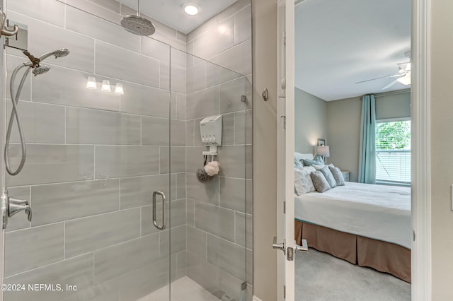 bathroom with ceiling fan and a shower with shower door