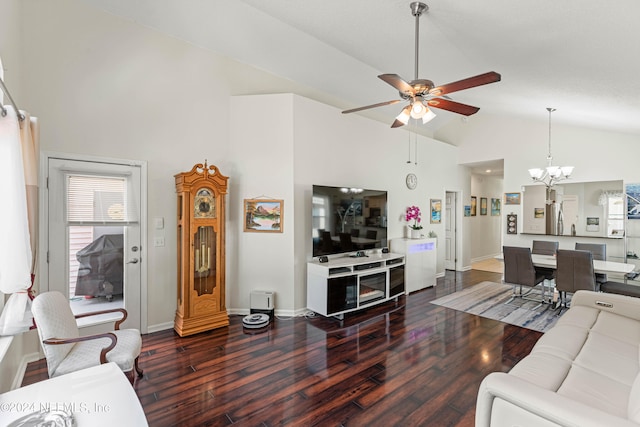 living room with high vaulted ceiling, ceiling fan with notable chandelier, and dark hardwood / wood-style flooring