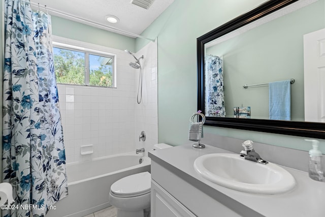 full bathroom featuring toilet, a textured ceiling, vanity, and shower / bath combination with curtain