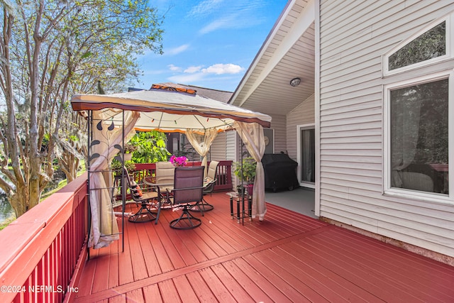 deck featuring area for grilling and a gazebo