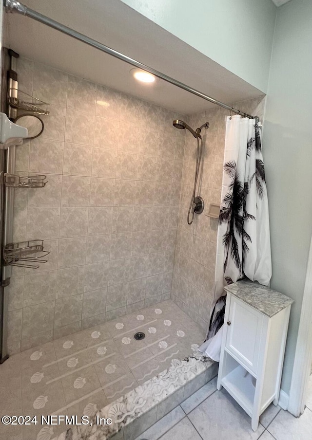 bathroom with tile patterned flooring and a shower with curtain