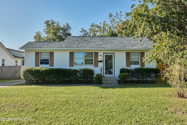 ranch-style house with a front yard