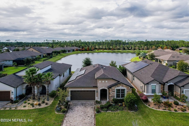 birds eye view of property with a water view