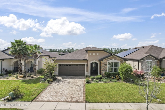 view of front facade featuring a front yard and a garage