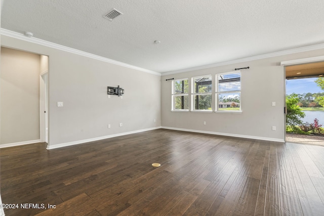 empty room with dark wood-type flooring, crown molding, and a textured ceiling