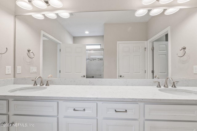 bathroom with vanity and walk in shower