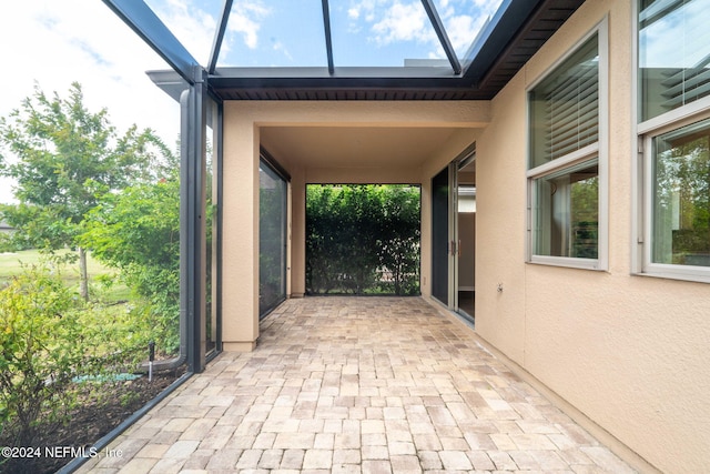 view of patio with a lanai