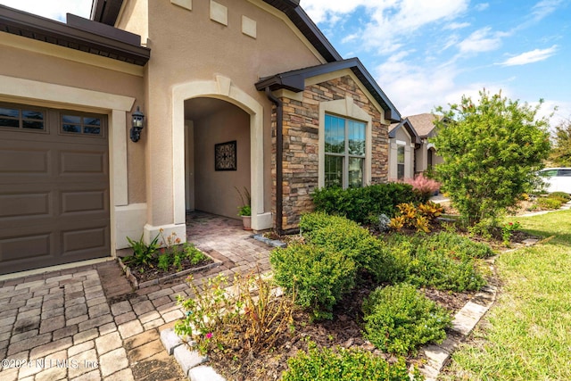 doorway to property featuring a garage