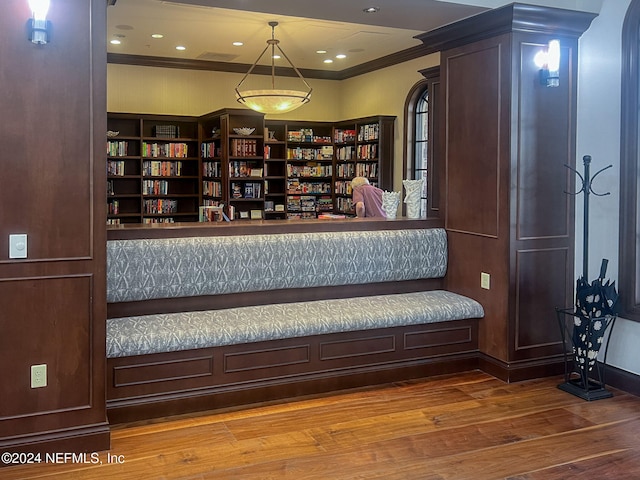 unfurnished room with crown molding and hardwood / wood-style flooring