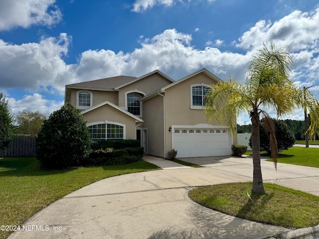 front of property featuring a garage and a front lawn