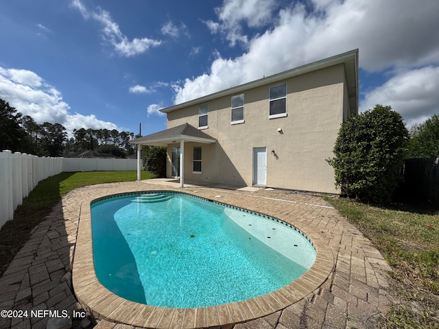 view of swimming pool with a patio area