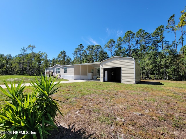 exterior space with a garage and a carport