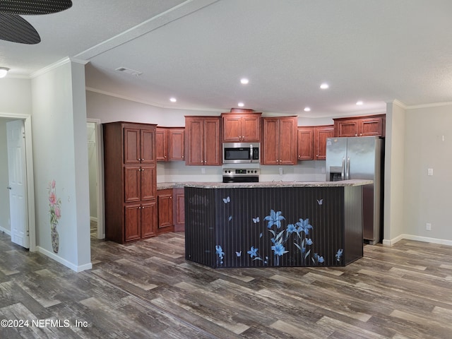 kitchen featuring a center island, stainless steel appliances, a kitchen bar, and dark hardwood / wood-style flooring