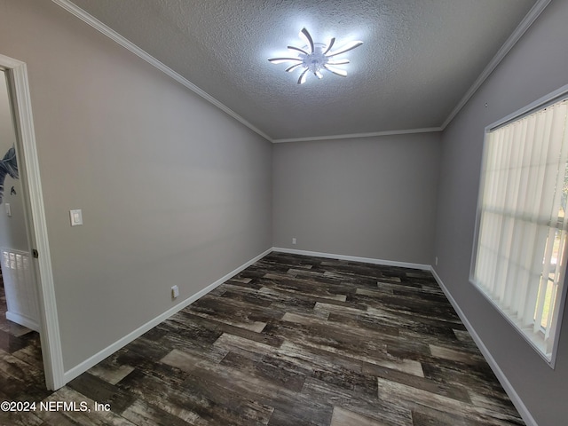 empty room featuring crown molding, a textured ceiling, dark wood-type flooring, and plenty of natural light