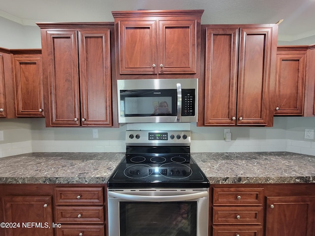 kitchen featuring crown molding and stainless steel appliances