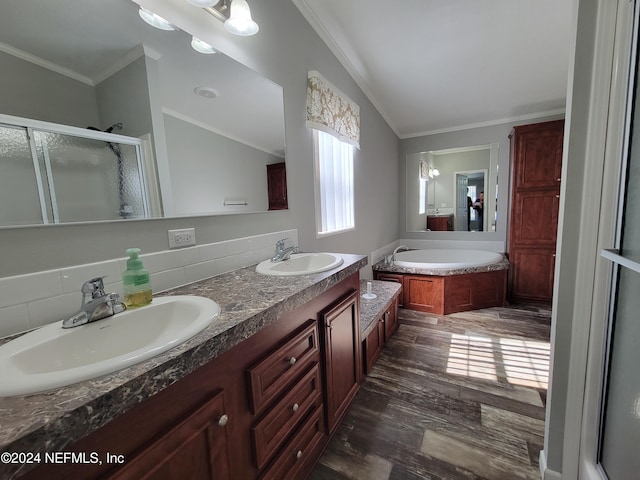 bathroom with tasteful backsplash, independent shower and bath, wood-type flooring, vanity, and crown molding