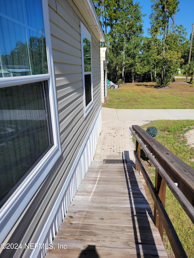 view of side of home with a lawn