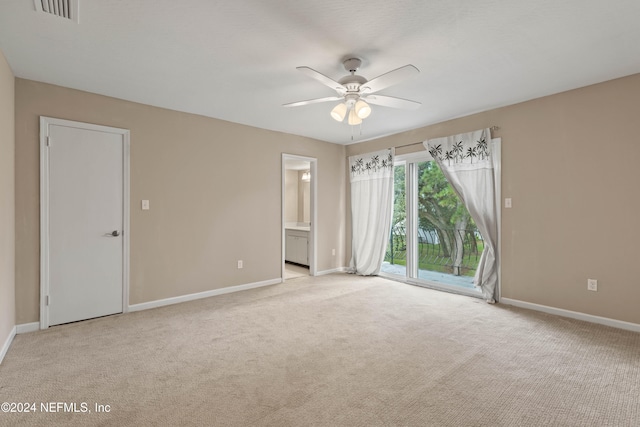 unfurnished room with light carpet and ceiling fan