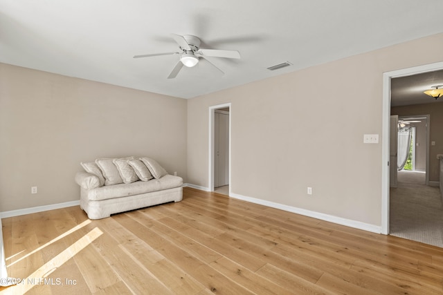 unfurnished room featuring light hardwood / wood-style floors and ceiling fan