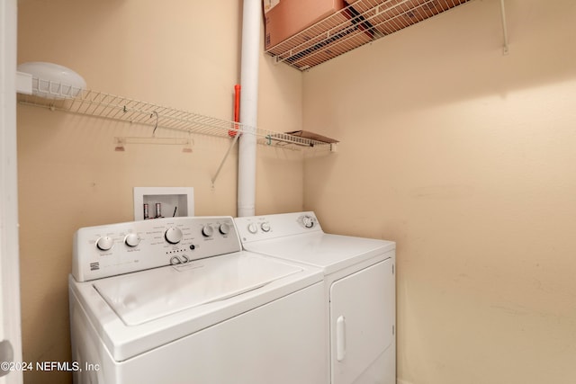 clothes washing area featuring washing machine and dryer